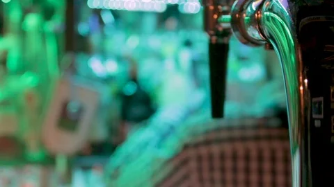 Silhouette of bartender back choosing alcoholic drinks bootles with beer tower Stock Footage 84762079