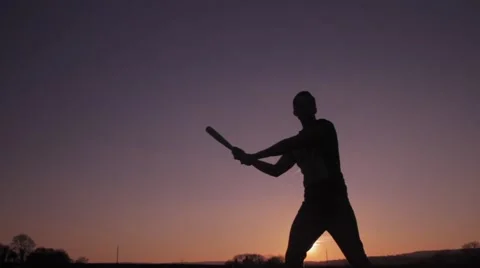 Silhouette baseball batter swing at sunset 動画素材 48896691