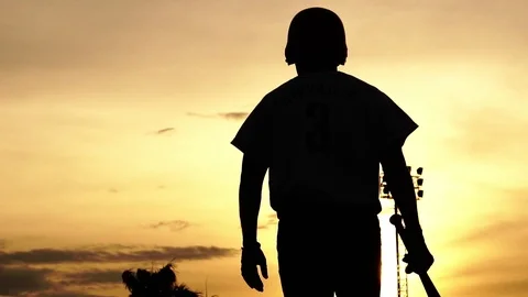 Silhouette baseball players were practicing in the evening Stock Footage
