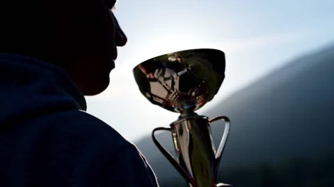 Silhouette best man kissing cup Winner Trophy Award Victory for professional Stock Footage