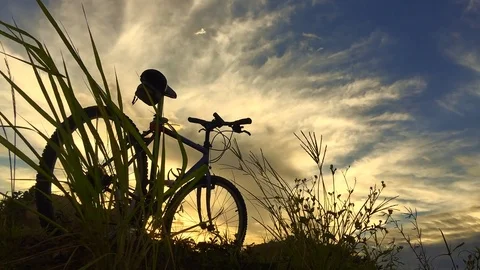 Silhouette bicycle parking and cloudscape. Stock Footage 76690846