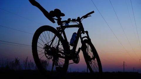 Silhouette of a bicycle at sunset. Stock Footage 88732272