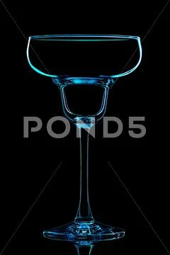 Silhouette of blue margarita glass with clipping path on black background Stock Photos