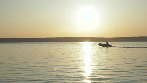 Silhouette of a boat passing by the camera Видео 144540110