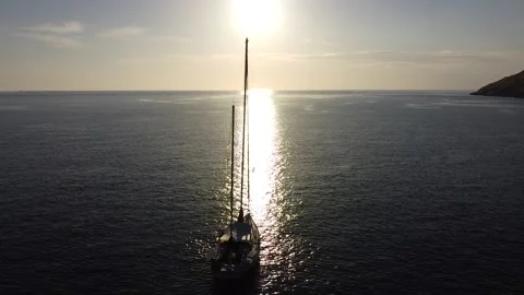 Silhouette of a boat in the rays of the sun Stock Footage 169502201