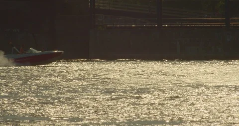 Silhouette of a boat speeding Stock Footage 114785585