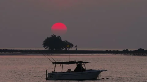 Silhouette of a boat at sunset Stock Footage 156709934
