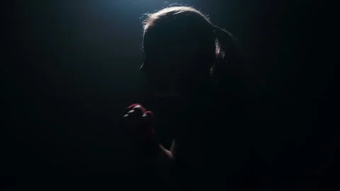 Silhouette of a boxer practicing a quick strike shadow boxing fight Stock-Footage 274450267