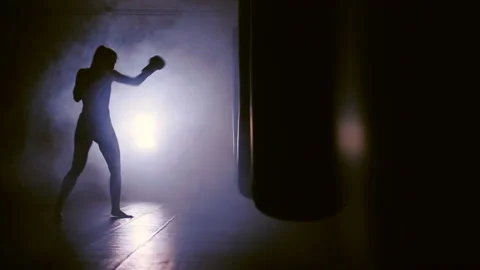 Silhouette of a Boxer striking in smoke Stock Footage 89375111