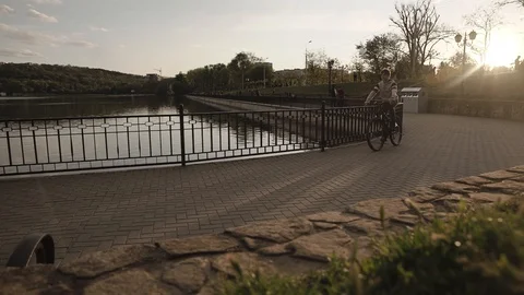 Silhouette of boy on the bicycle Stock Footage 130001177
