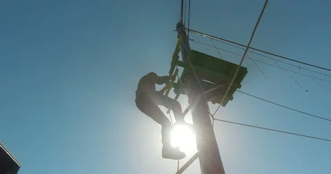 Silhouette of a boy climbing down the stairs in an adrenaline park Stock Footage 88744893