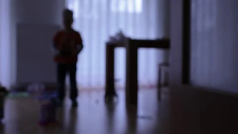 Silhouette of a boy playing in a room Stock Footage 270458405