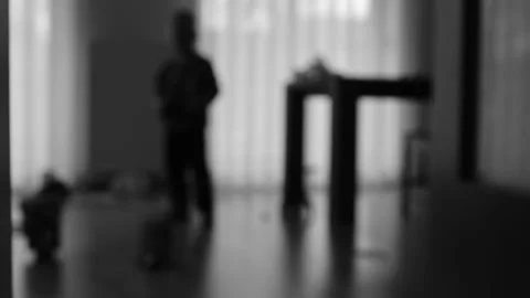 Silhouette of a boy playing in a room Stock Footage 270458409