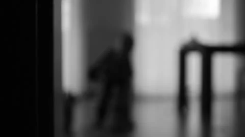 Silhouette of a boy playing in a room Stock Footage 270458410