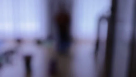 Silhouette of a boy playing in a room Stock Footage 270458492