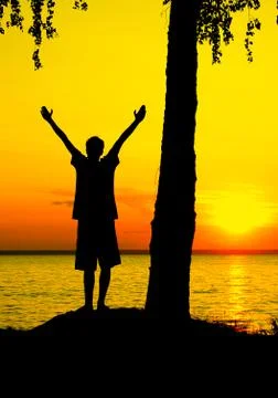 Silhouette of a Boy at Sunset Foto stock