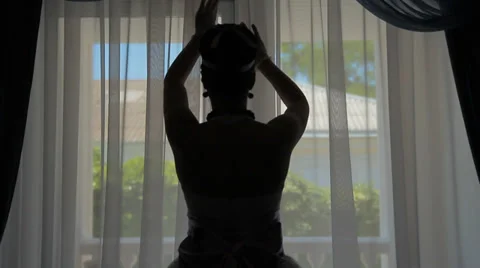 Silhouette bride on a background of a window Stock Footage 36157181