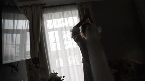 Silhouette of bride in white robe Stock Footage 302309813