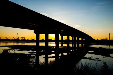 The silhouette of the bridge Stock Photos
