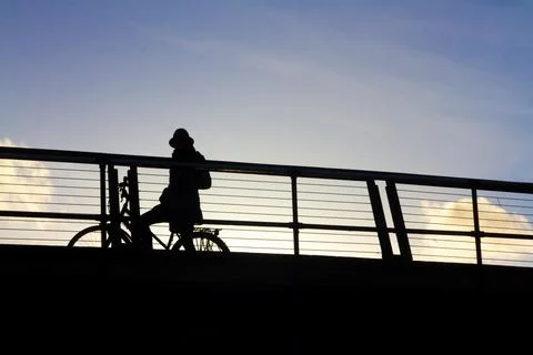 SIlhouette on a bridge Stock Photos
