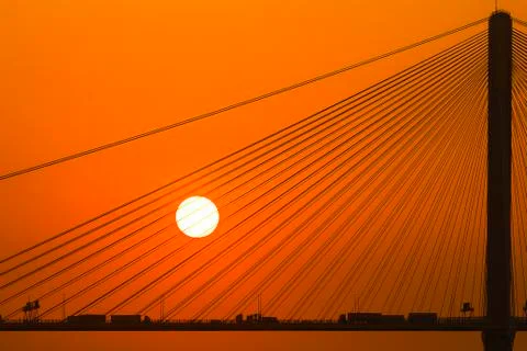 Silhouette of a bridge under setting sun Stock-Fotos