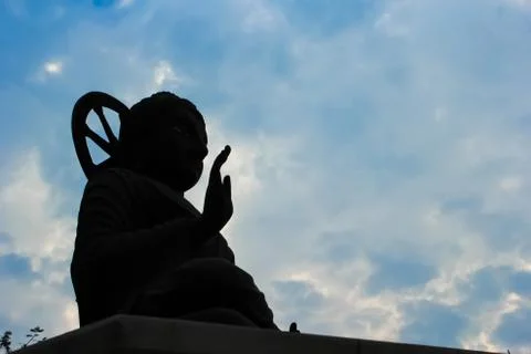 Silhouette of buddha statue Stock Photos