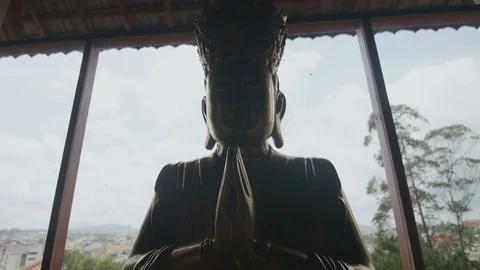 Silhouette of a buddha in a temple close-up Stock Footage 73652007