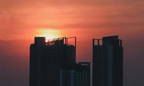 Silhouette building with sunset Stock Photos
