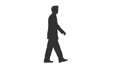 silhouette man in suit walking
