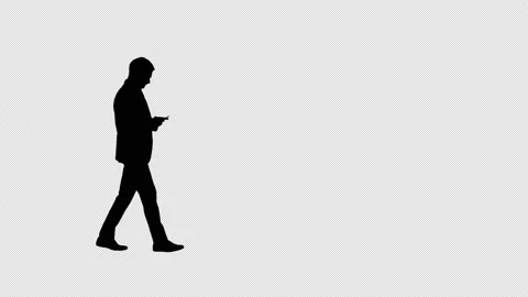 Silhouette Businessman using smartphone while walking by, Alpha Channel Vídeos de archivo 155977679
