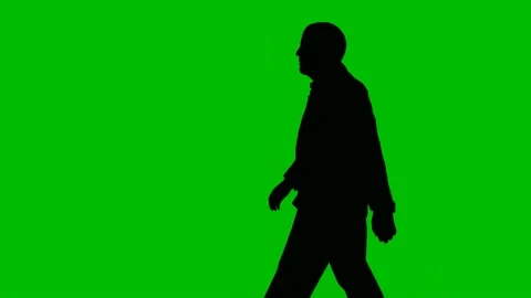 Silhouette Businessman Walking On Green  