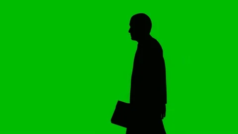 Silhouette businessman walking on green ... | Stock Video | Pond5