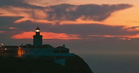 Silhouette of The Cabo da Roca Lighthouse at Sintra, 4k footage sunset 스톡 동영상 148355717