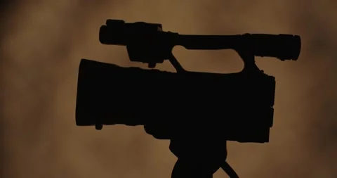 Silhouette of a Camera with Artistic Background Vídeo Stock 328013898