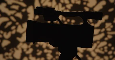 Silhouette of a Camera with Artistic Background Stock Photos