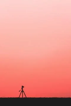 Silhouette of a camera on a tripod Stock Photos