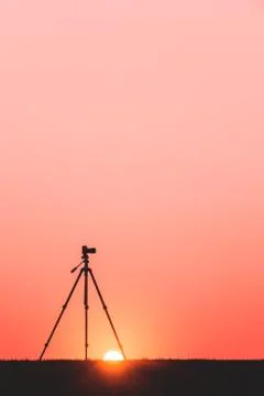 Silhouette of a camera on a tripod Stock Photos