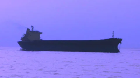 Silhouette cargo ship in the night sea Stock Footage