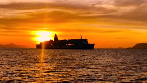 A silhouette of a Cargo ship at sunset, Spain Vídeos de archivo 239178920