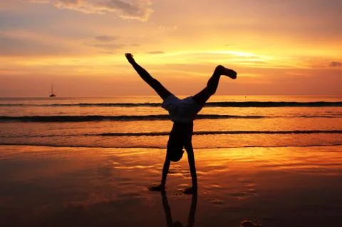 Silhouette of child on the beach Stock Photos