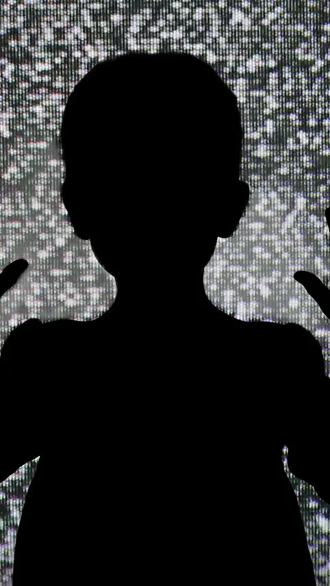 Silhouette of Child Behind Screen With White Mask Creates Mystery And Fear .. Stock Footage 330554400