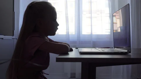 Silhouette child at computer at home Video stock 137216966
