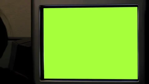 Silhouette of Child Using Green Screen Computer in Dim Classroom Stock Footage 296391012