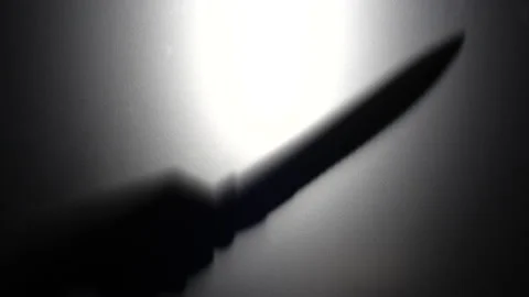 man with knife silhouette