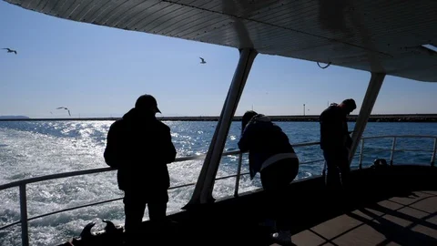 Silhouette of Commuters on a Ferry in Slow Motion Istanbul, Turkey Stock Footage 128376262