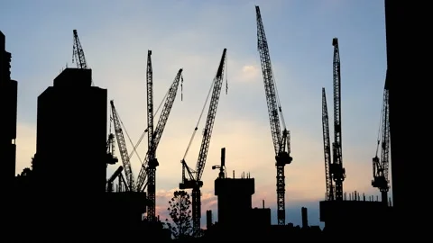 Silhouette of a Construction Crane in Action Stock Footage 238796143