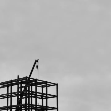 SILHOUETTE CONSTRUCTION CRANE Stock Photos