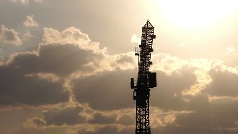 Silhouette of construction cranes. Background clouds the sunset  Stock Footage 122443727