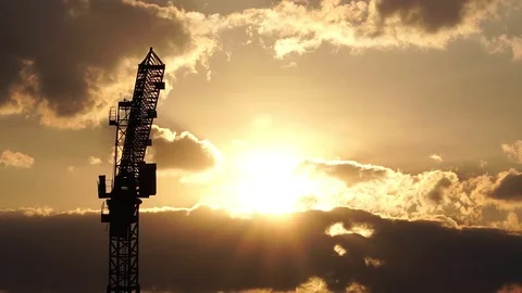 Silhouette of construction cranes. Background clouds the sunset  Stock Footage 122443737