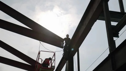 Silhouette Construction Worker Installing Large Steel Beam To Structure 4K 4 Stock Footage 265803960